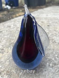 This item is a vintage Murano glass pear paperweight, often designed by artists